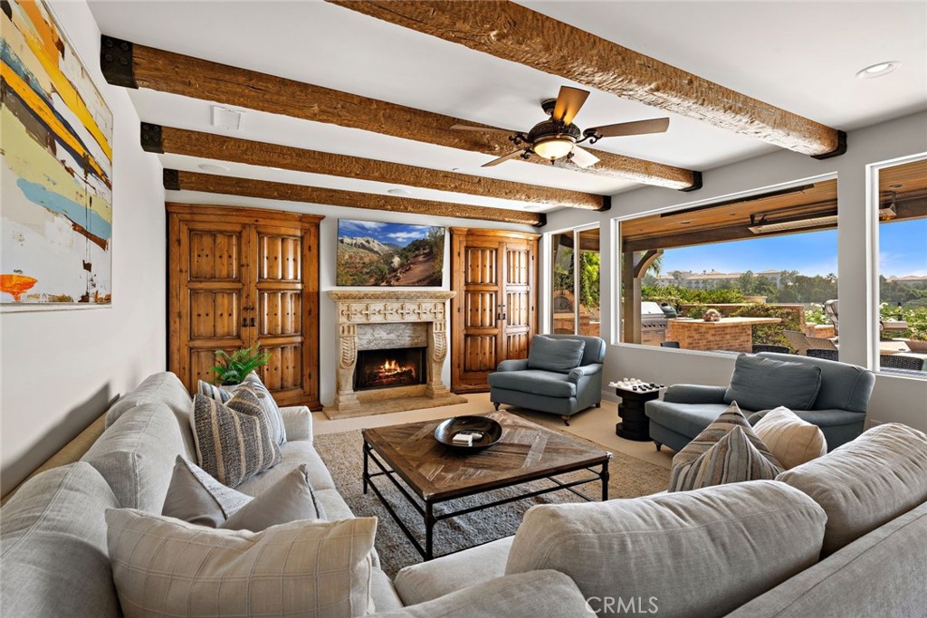 5 Via Monarca Street Dana Point, CA 92629 - Photo 4 of 57 a living room with furniture fireplace and a large window