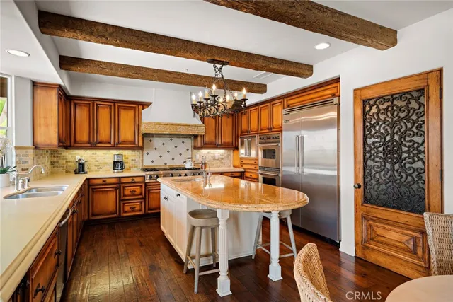 a kitchen with a sink and a large window