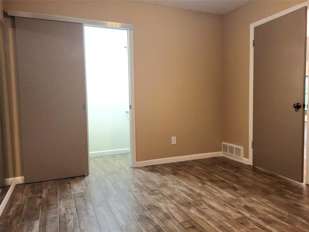 912 North Dove Road Grapevine, TX 76051 - Photo 16 of 36 a view of an empty room with wooden floor