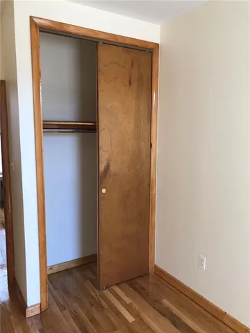 a kitchen with a refrigerator and a stove top oven