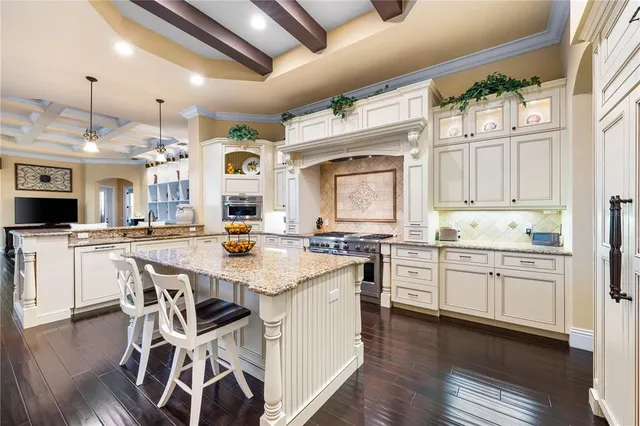 a view of a patio with chairs and wooden floor