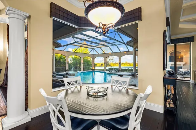 a living room with furniture a rug and a chandelier