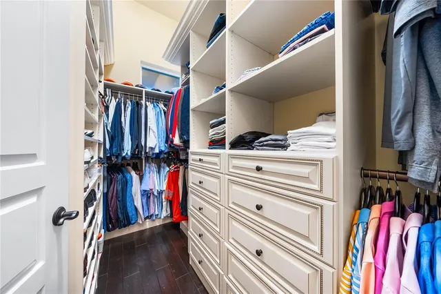 an aerial view of residential houses with outdoor space and lake view