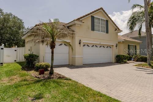 65 Calliope Street Ocoee, FL 34761 - Photo 4 of 60 a front view of a house with garden