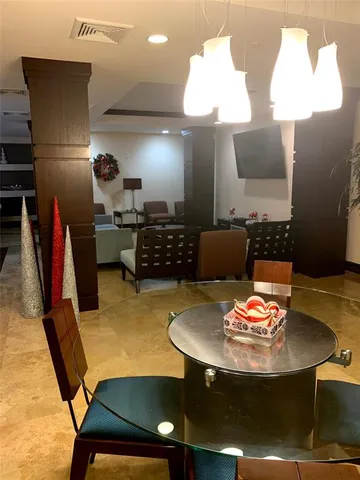 a view of kitchen with counter top space and cabinets