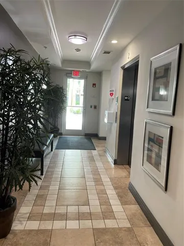 a view of a building with sitting area