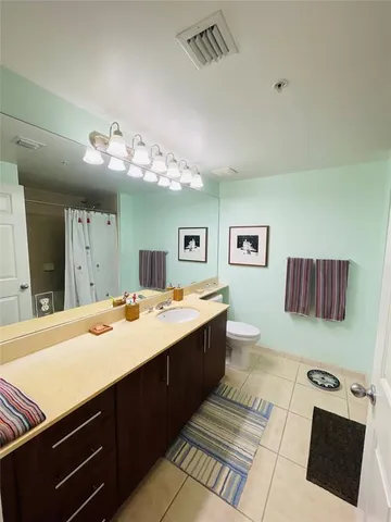 a view of a living room and bathroom