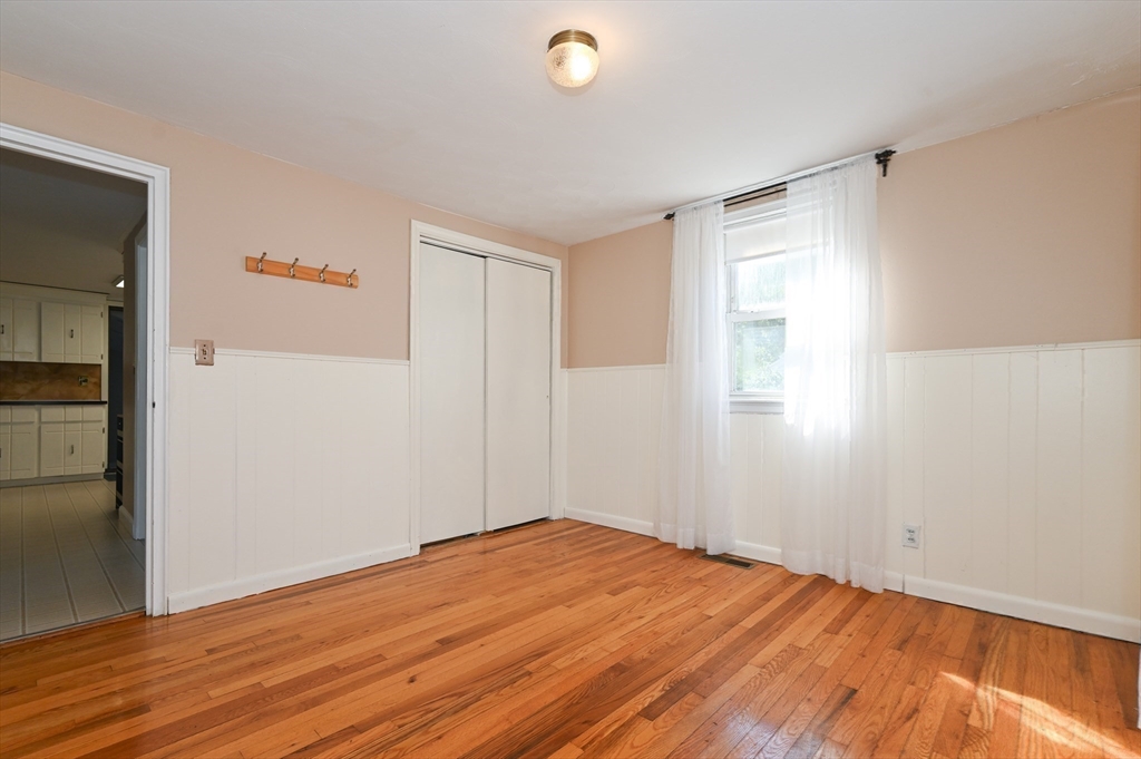 1 Linda Road Sharon, MA 02067 - Photo 13 of 25 a view of empty room with wooden floor and fan