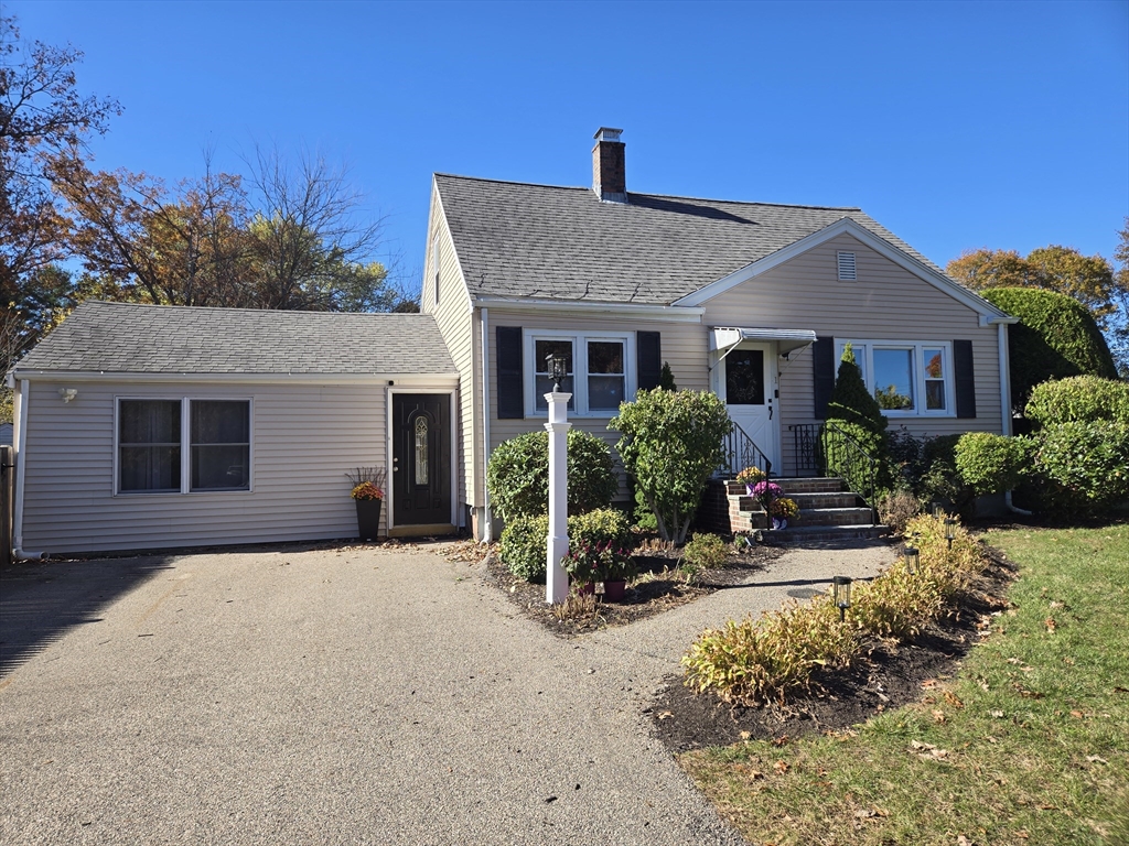 1 Linda Road Sharon, MA 02067 - Photo 25 of 25 a front view of a house with sitting area and garden