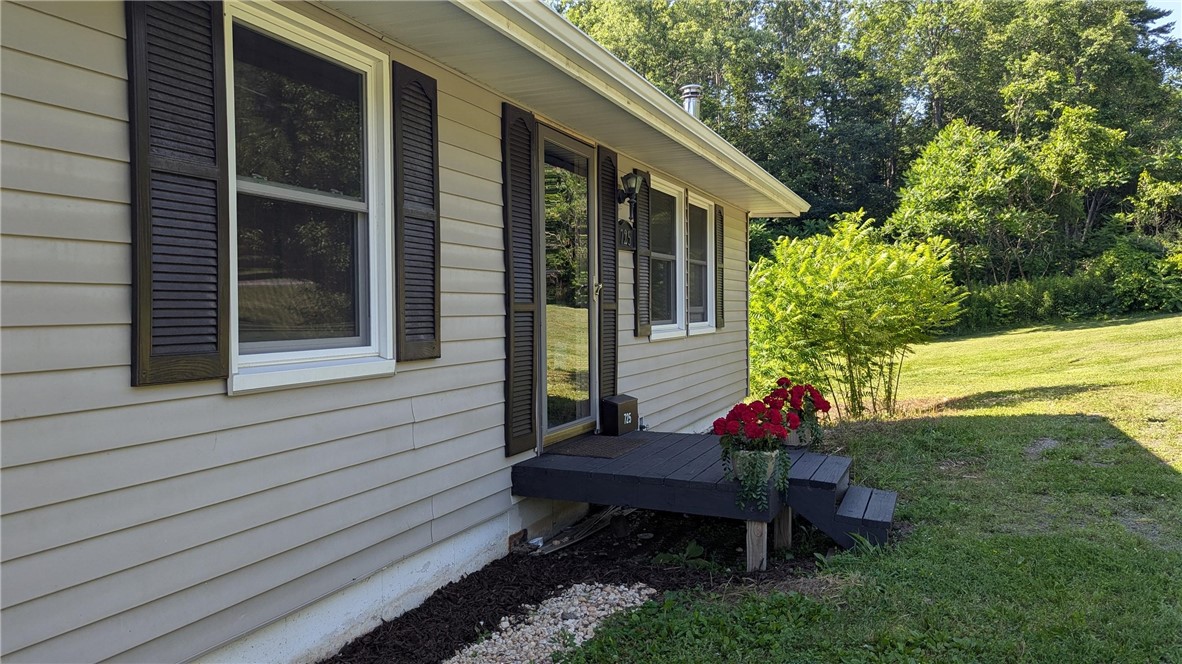 725 State Street Oneonta, NY 13820 - Photo 3 of 25 Vinyl siding, replacement windows.
