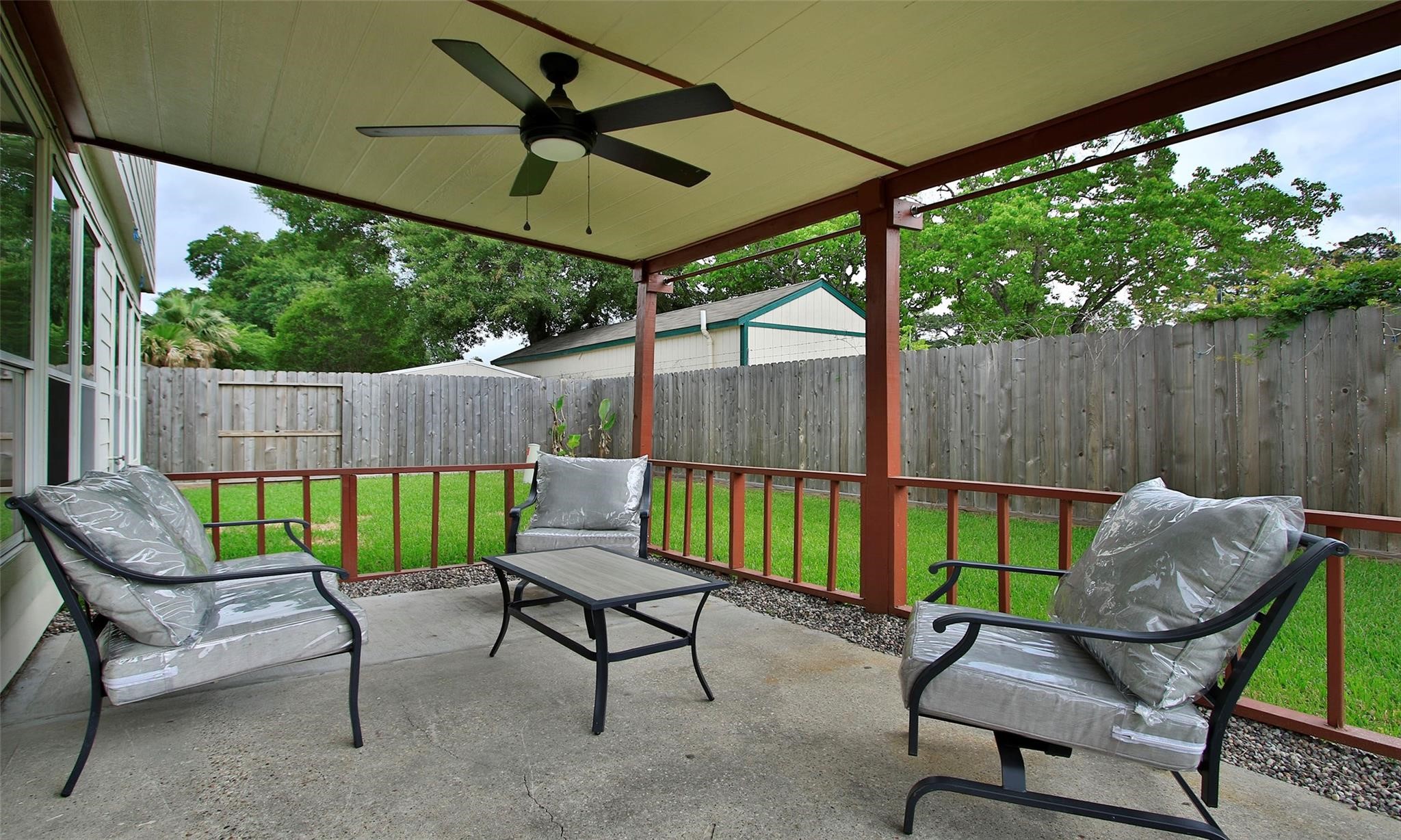 20506 Spring Lilac Lane Spring, TX 77388 - Photo 31 of 33 a view of a chairs and table in the back yard of a house