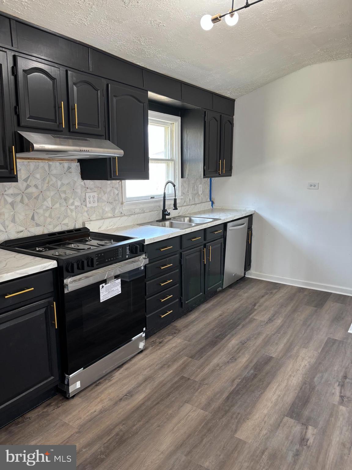 1 Cherry Lane Elkton, MD 21921 - Photo 3 of 12 a kitchen with stainless steel appliances granite countertop a stove a sink and a microwave