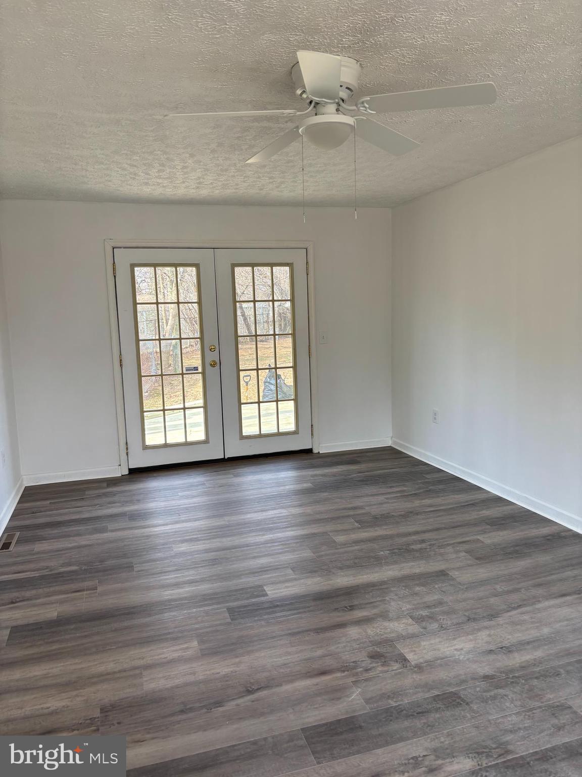 1 Cherry Lane Elkton, MD 21921 - Photo 4 of 12 wooden floor in an empty room with a window