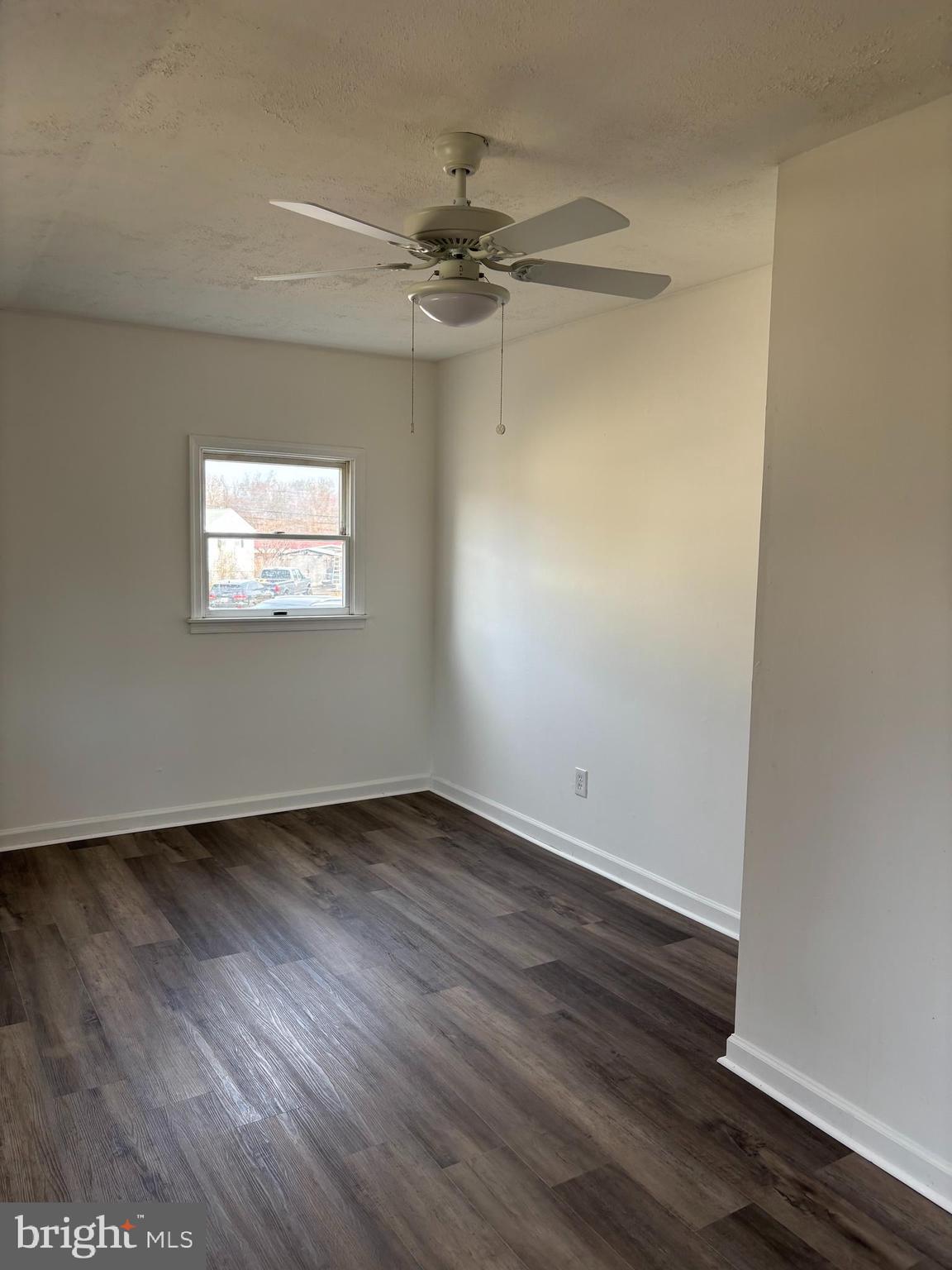 1 Cherry Lane Elkton, MD 21921 - Photo 9 of 12 a view of an empty room with wooden floor and a window