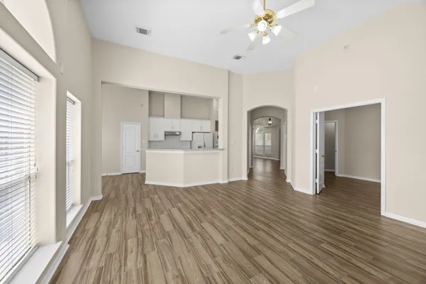 a view of a room with wooden floor and cabinet