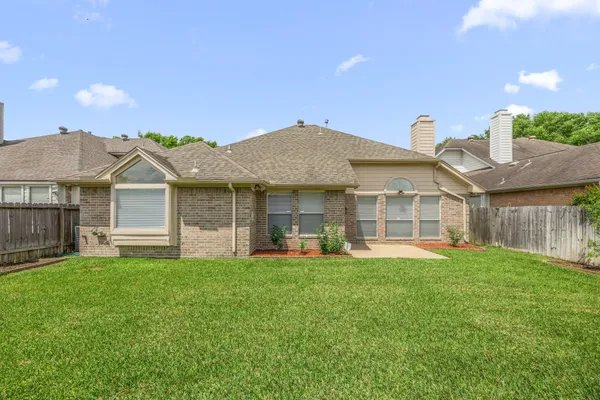 a front view of a house with a yard and porch