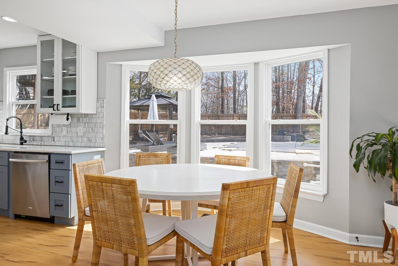 4308 Hickory Ridge Drive Raleigh, NC 27609 - Photo 13 of 46 a view of a dining room with furniture window and wooden floor