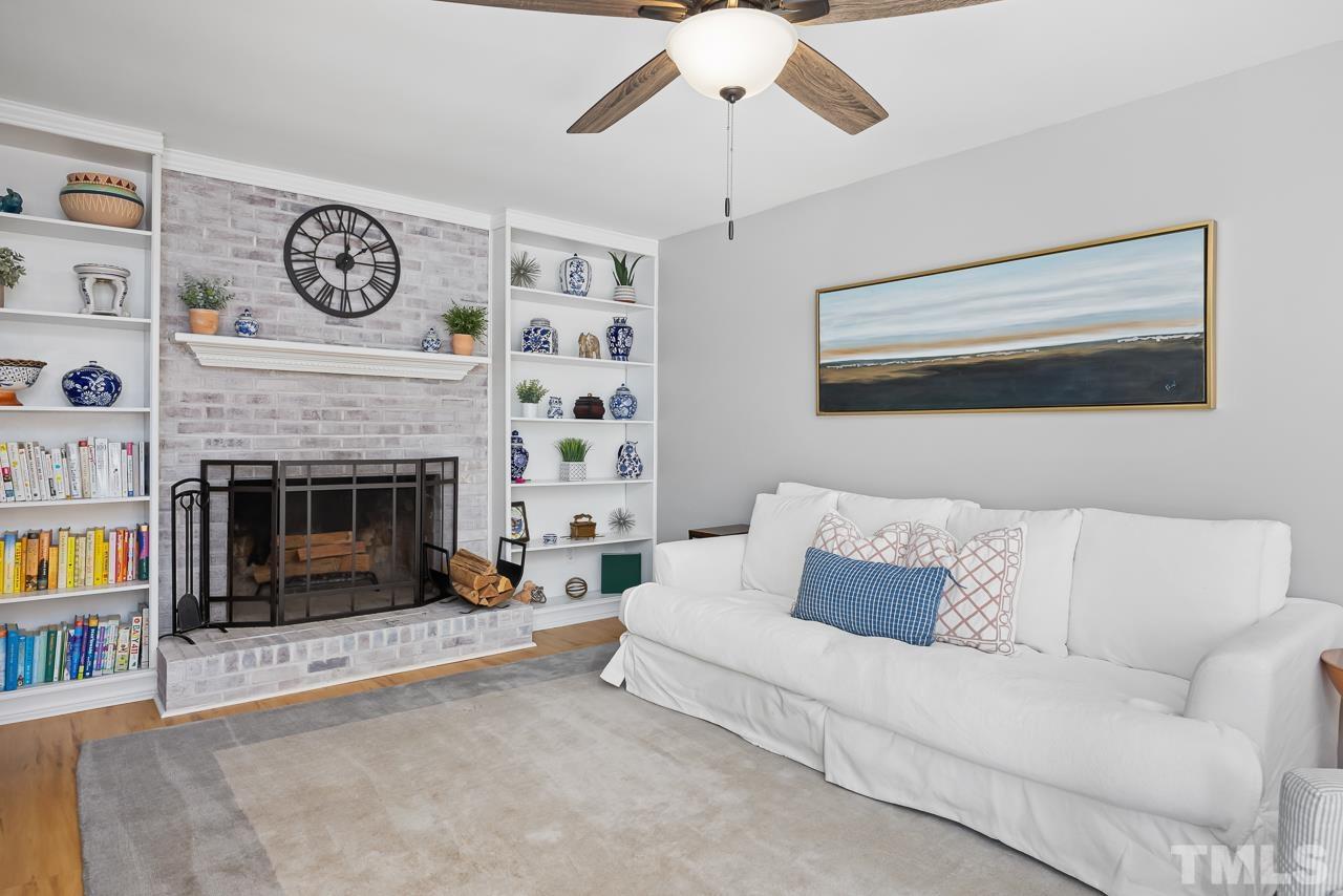 4308 Hickory Ridge Drive Raleigh, NC 27609 - Photo 16 of 46 a living room with furniture and a fireplace