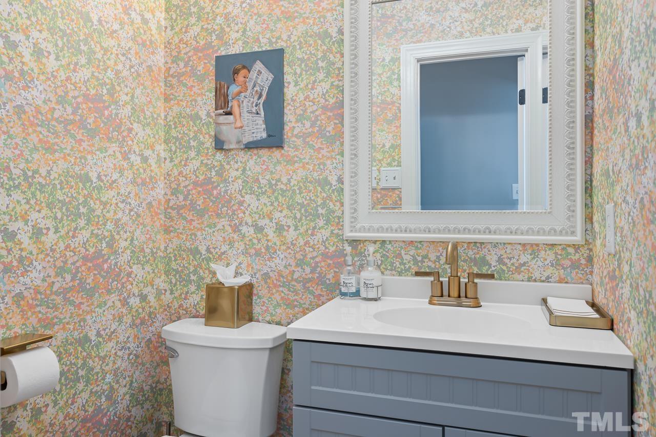 4308 Hickory Ridge Drive Raleigh, NC 27609 - Photo 17 of 46 a bathroom with a sink and a toilet