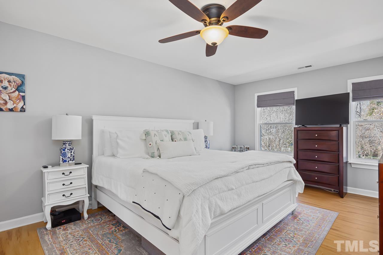 4308 Hickory Ridge Drive Raleigh, NC 27609 - Photo 18 of 46 a bedroom with a bed and a tv