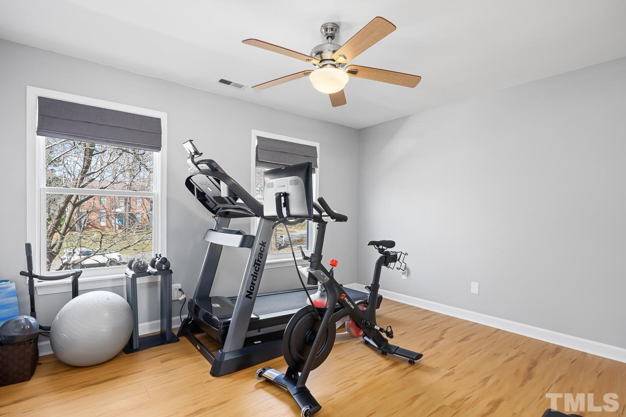 4308 Hickory Ridge Drive Raleigh, NC 27609 - Photo 24 of 46 a room with gym equipment and windows