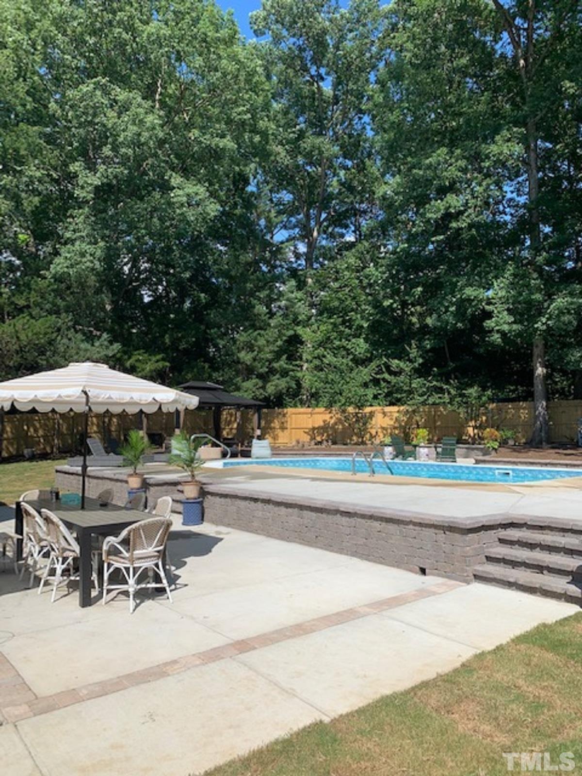 4308 Hickory Ridge Drive Raleigh, NC 27609 - Photo 27 of 46 an outdoor space with swimming pool and furniture