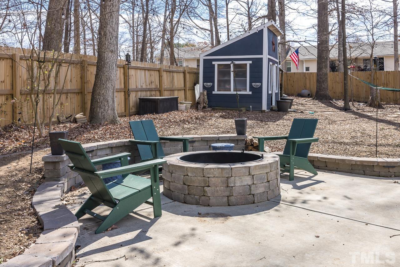 4308 Hickory Ridge Drive Raleigh, NC 27609 - Photo 31 of 46 a view of house with backyard outdoor seating and wooden fence
