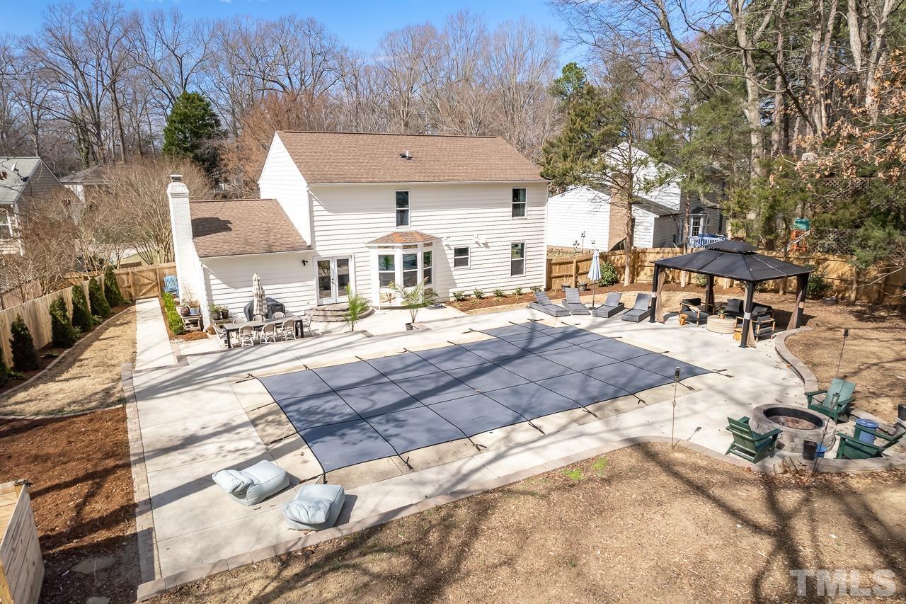 4308 Hickory Ridge Drive Raleigh, NC 27609 - Photo 39 of 46 a view of multiple houses with yard and trees