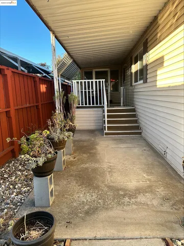 a view of a porch with furniture