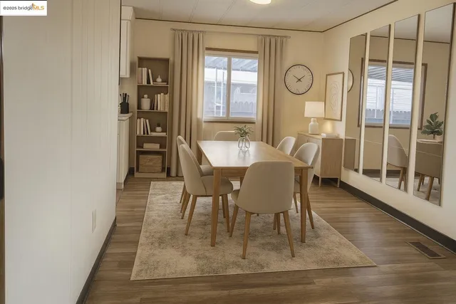 a dining room with furniture and window