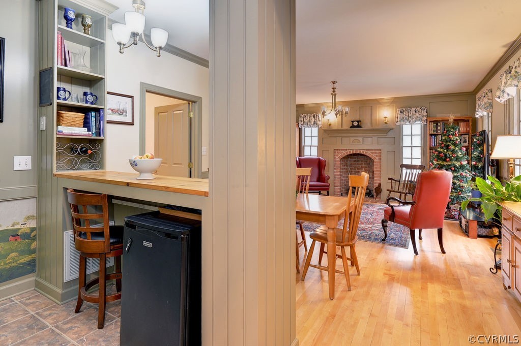 103 Gullane Williamsburg, VA 23188 - Photo 11 of 44 a living room with furniture a fireplace and a book shelf
