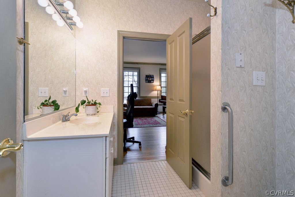 103 Gullane Williamsburg, VA 23188 - Photo 17 of 44 a en suite bathroom with a sink a mirror and a shower