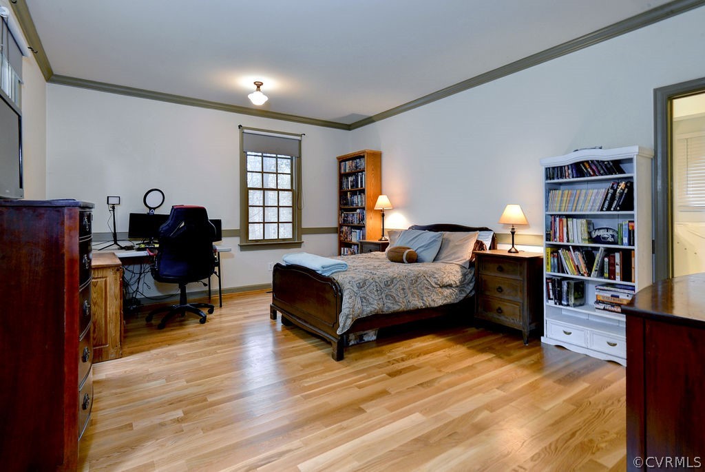 103 Gullane Williamsburg, VA 23188 - Photo 18 of 44 a bedroom with a bed furniture and a book shelf