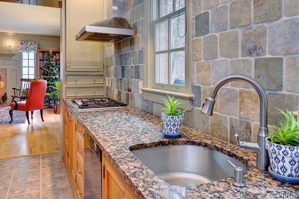 103 Gullane Williamsburg, VA 23188 - Photo 22 of 44 a kitchen with stainless steel appliances granite countertop a sink a stove and a wooden cabinets