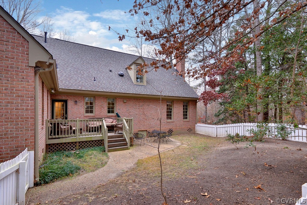 103 Gullane Williamsburg, VA 23188 - Photo 32 of 44 a front view of a house with a yard and a large tree