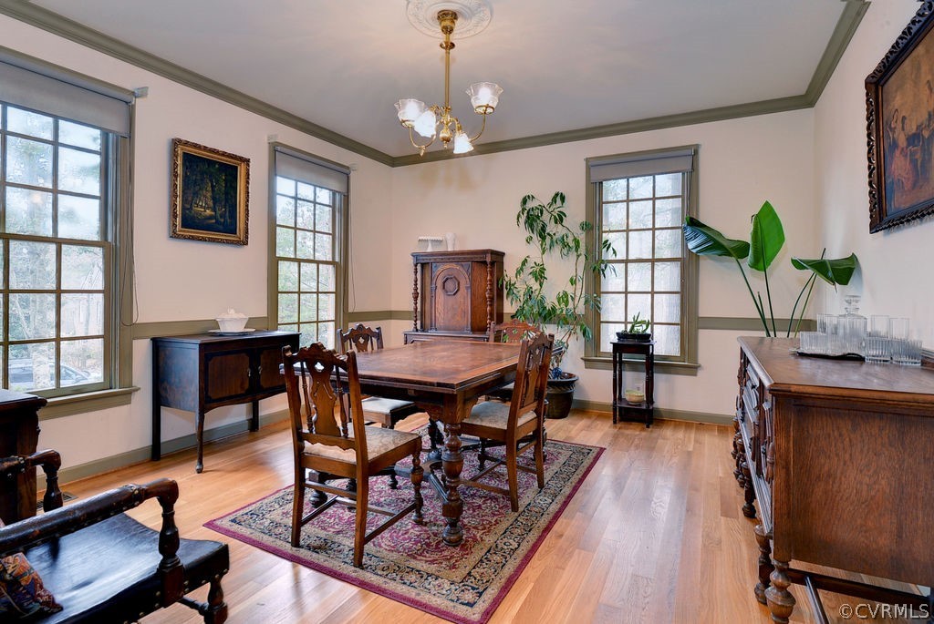 103 Gullane Williamsburg, VA 23188 - Photo 6 of 44 a view of a dining room with furniture window and wooden floor