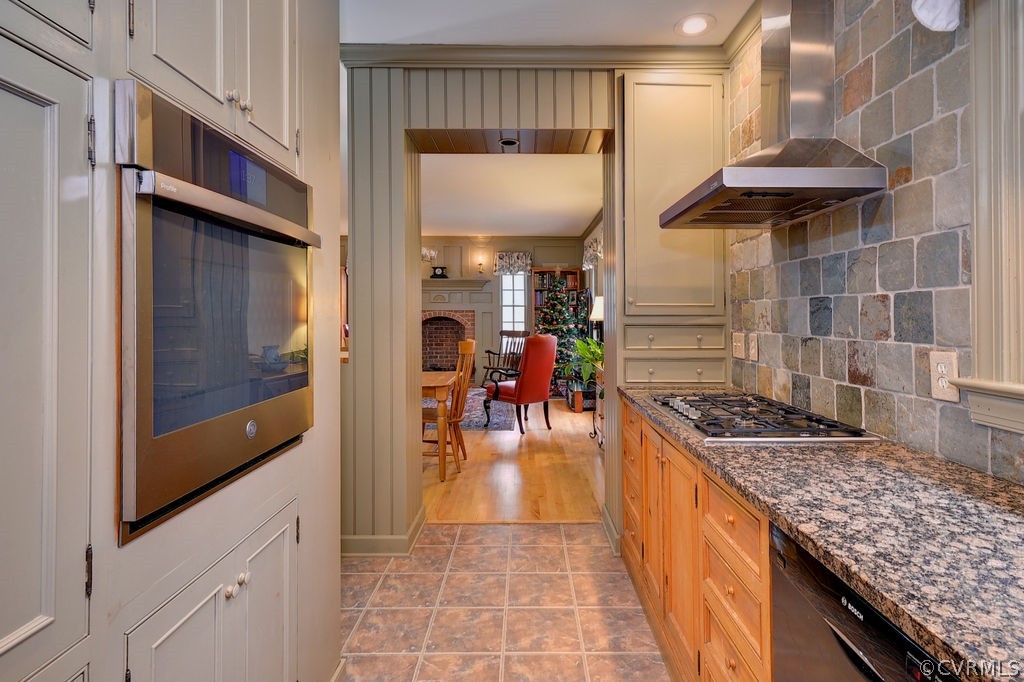 103 Gullane Williamsburg, VA 23188 - Photo 7 of 44 a kitchen with stainless steel appliances granite countertop a stove and a wooden cabinets