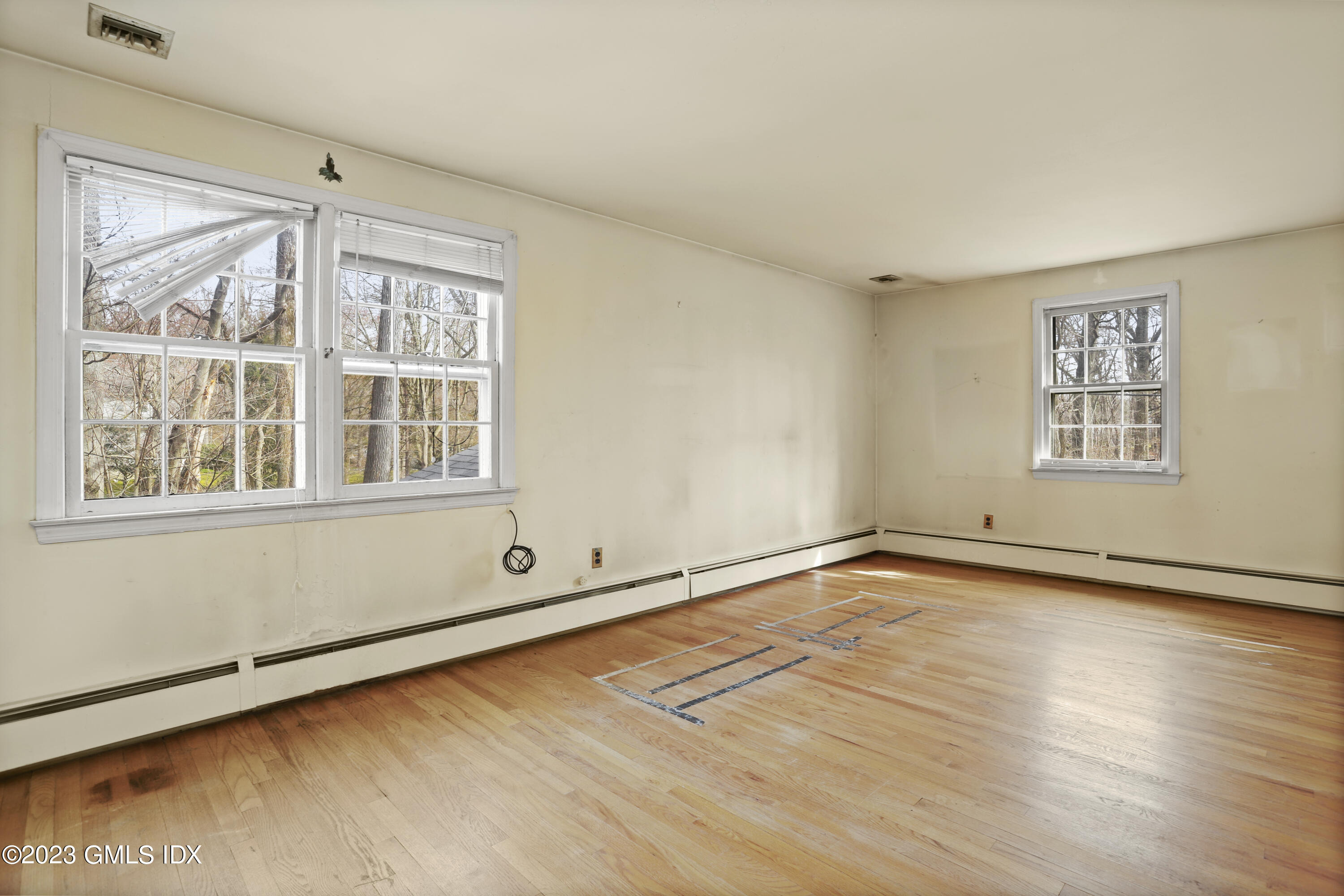 46 Dandy Drive Cos Cob, CT 06807 - Photo 13 of 26 a view of an empty room with a window and wooden floor