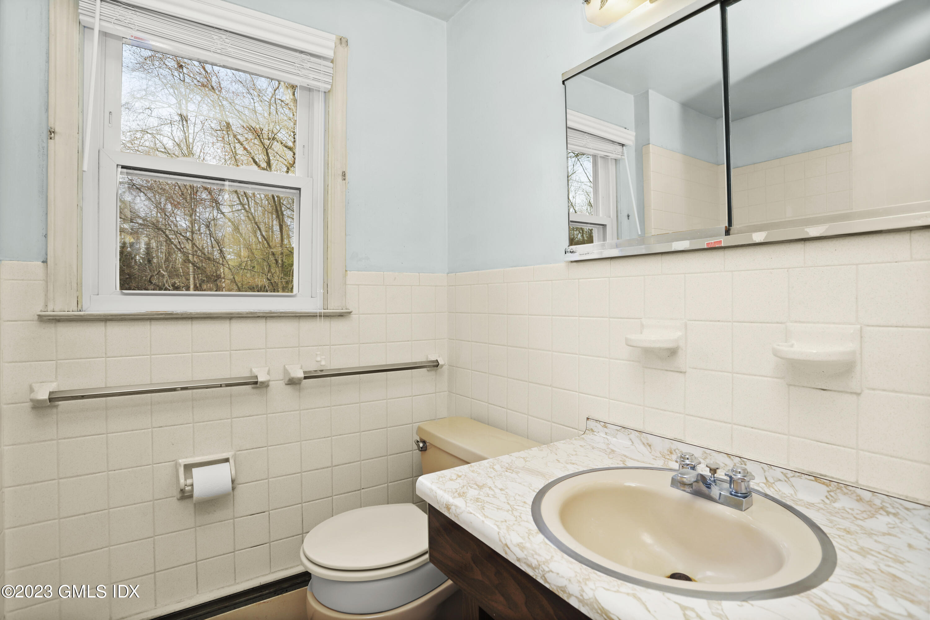 46 Dandy Drive Cos Cob, CT 06807 - Photo 14 of 26 a bathroom with a toilet a sink and a mirror