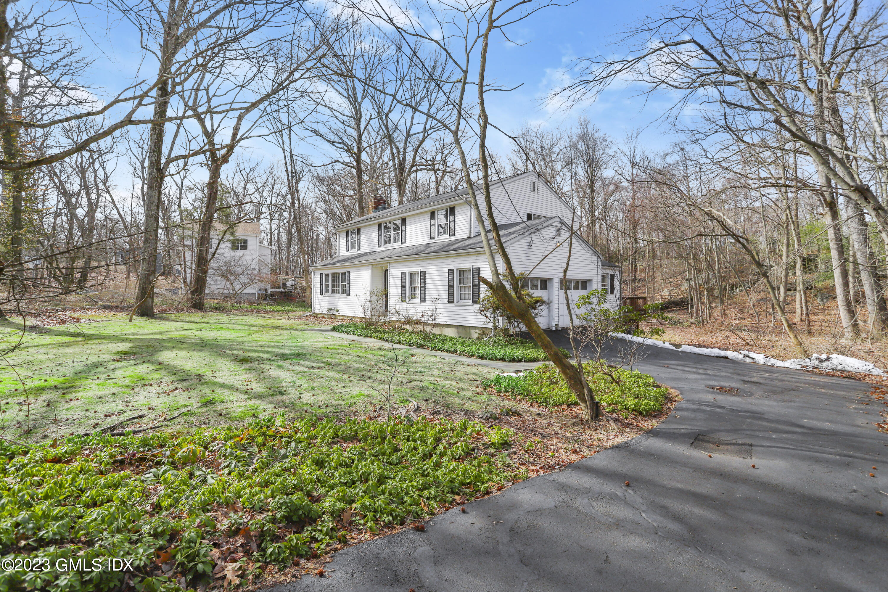 46 Dandy Drive Cos Cob, CT 06807 - Photo 2 of 26 a house that has a tree in front of it