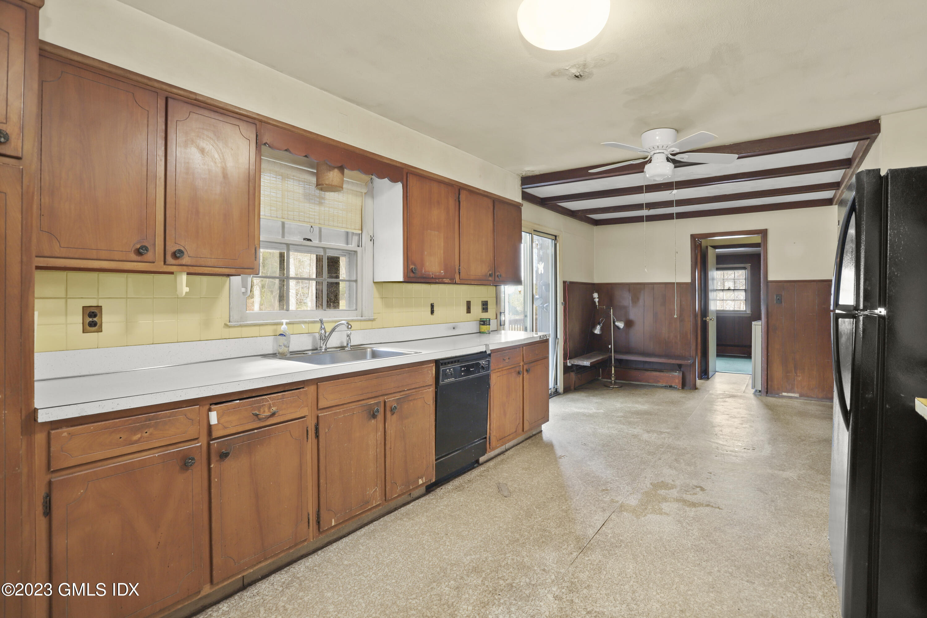 46 Dandy Drive Cos Cob, CT 06807 - Photo 22 of 26 a kitchen with granite countertop a sink cabinets stainless steel appliances and a window