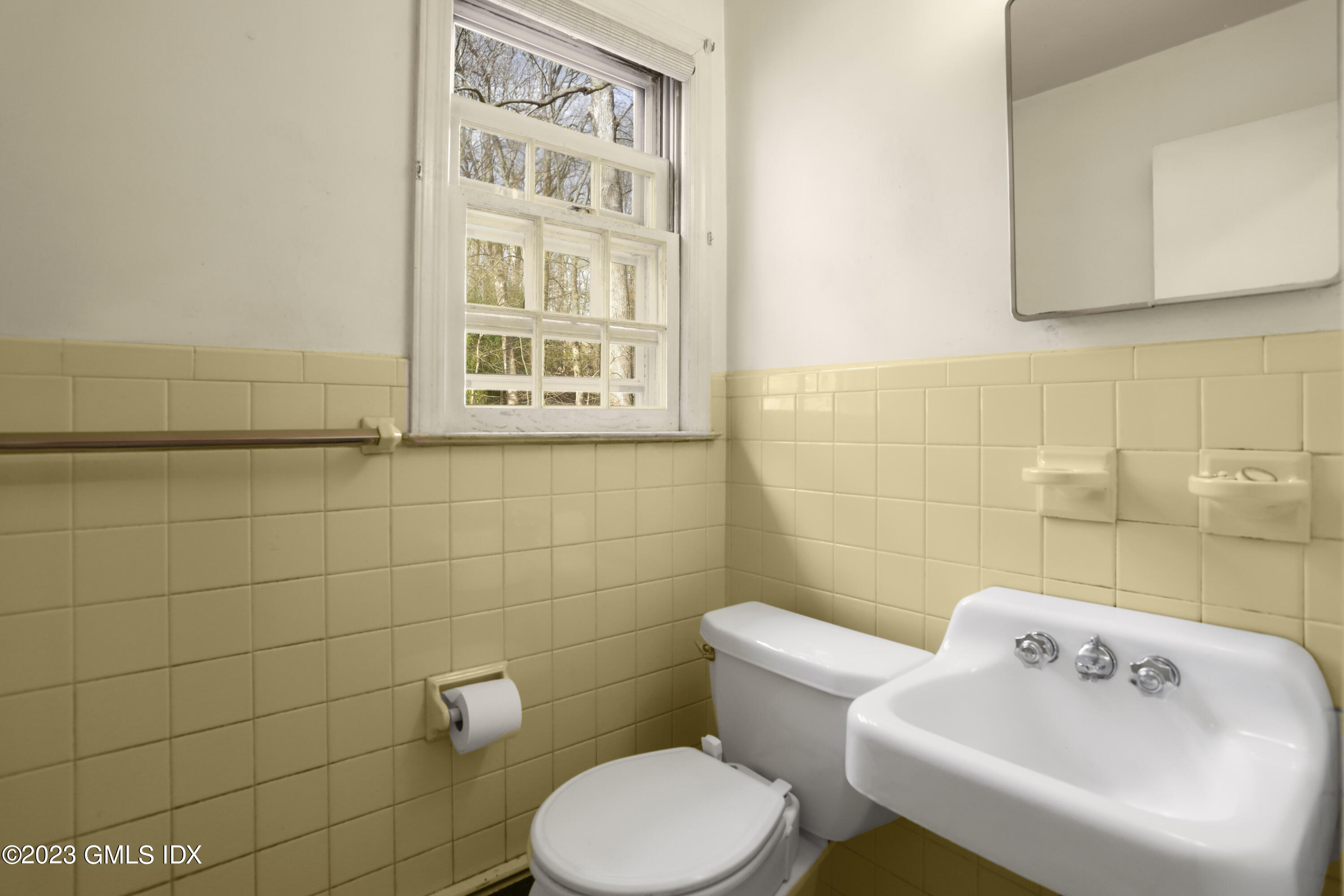 46 Dandy Drive Cos Cob, CT 06807 - Photo 24 of 26 a white toilet sitting next to a bathroom sink