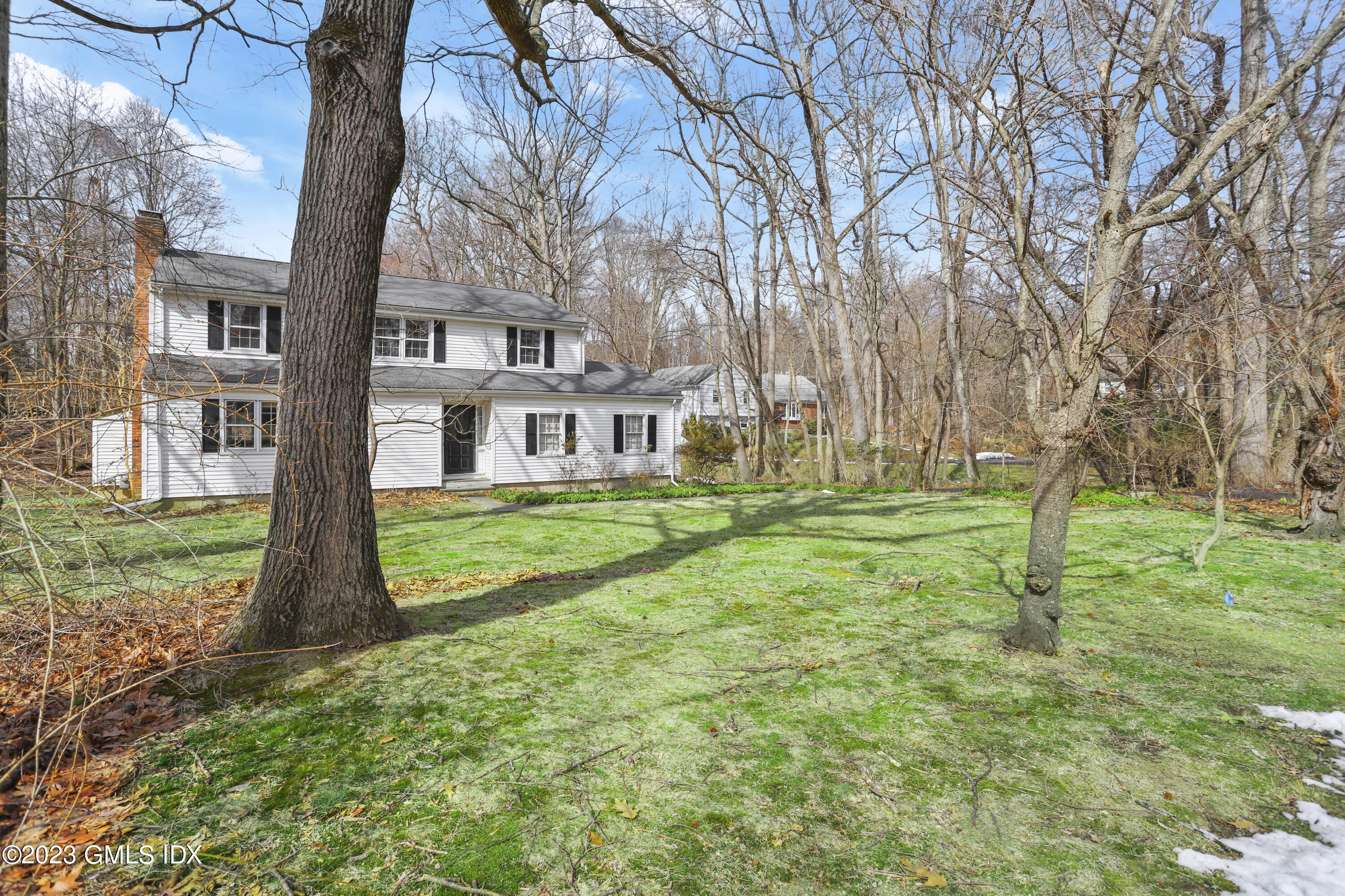 46 Dandy Drive Cos Cob, CT 06807 - Photo 7 of 26 a front view of a house with garden