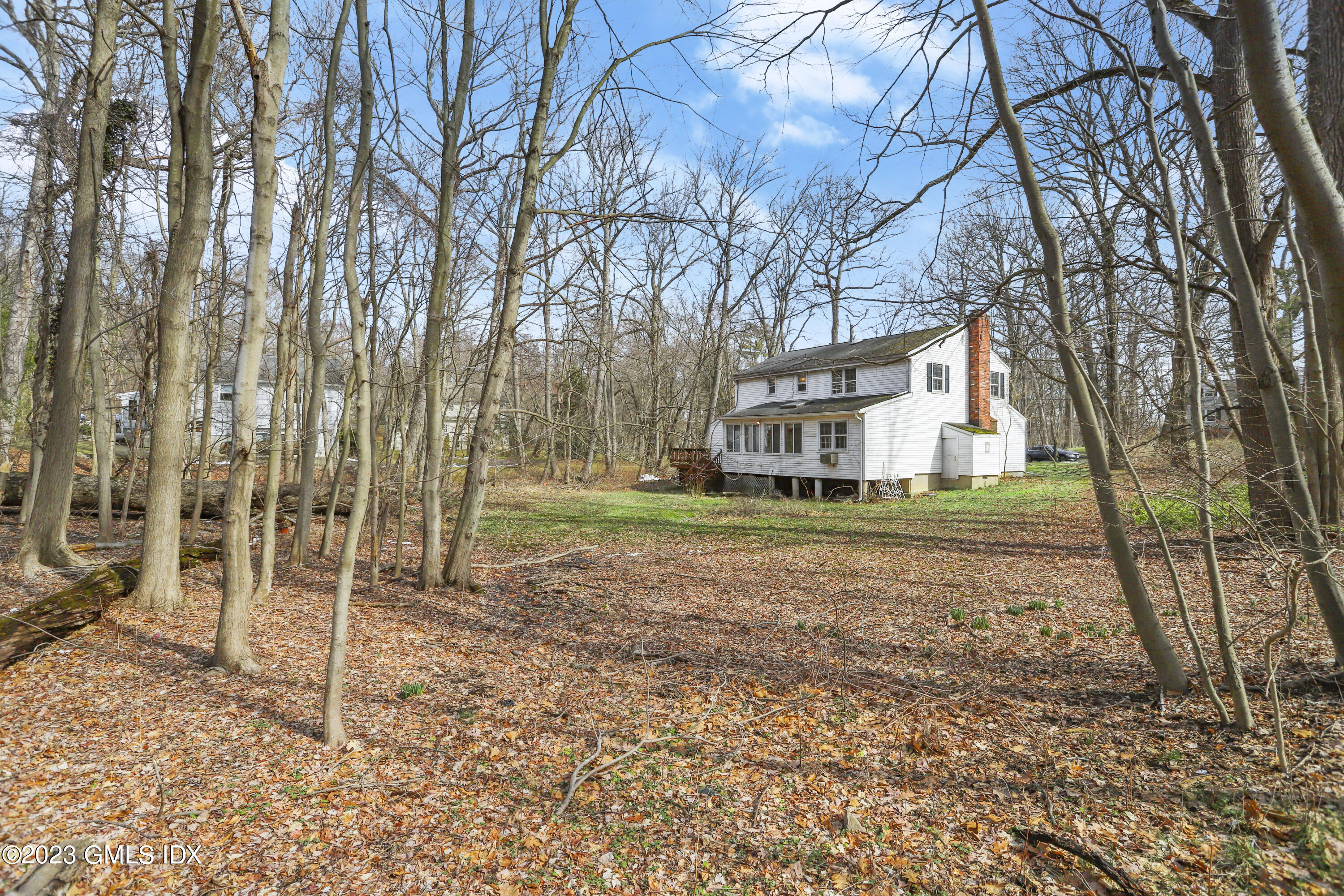 46 Dandy Drive Cos Cob, CT 06807 - Photo 10 of 26 a house view with a backyard space