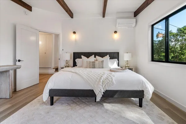 a bathroom with a double vanity sink mirror and toilet