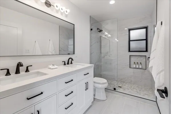 a bathroom with a bathtub and a shower