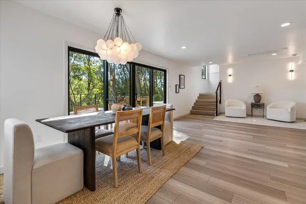 a view of a dining room with furniture window and outside view