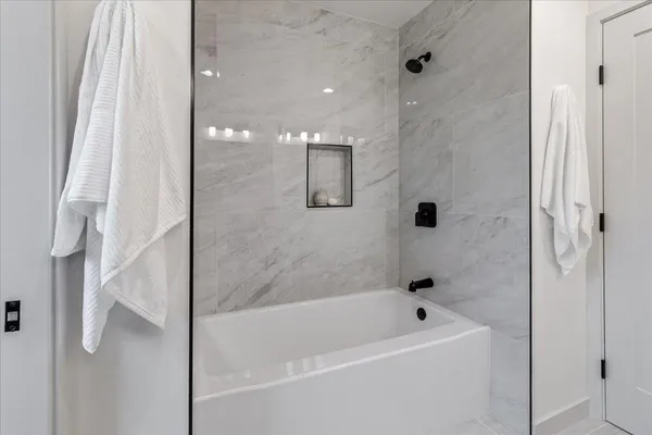 a bathroom with a sink a mirror and a shower