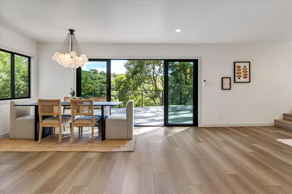 a view of a dining room with furniture window and outside view