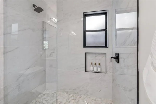 a view of a deck with table and chairs and wooden floor